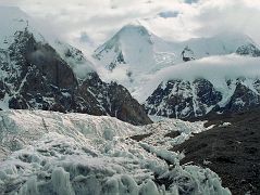 16 Gasherbrum I and Gasherbrum I South From Abruzzi Glacier The next morning we started our trek to Gasherbrum base camp in mostly cloudy weather. After 30 minutes we reached �Gasherbrum Corner� at the junction of the Upper Baltoro Glacier with the tributary Abruzzi Glacier. Gasherbrum I and Gasherbrum I South lie straight ahead. Gasherbrum I (8080m) is the 11th highest mountain in the world. Gasherbrum I was first climbed by July 5, 1958 by Americans Pete Schoening and Andy Kauffman.